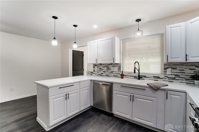 kitchen with dishwasher, dark hardwood / wood-style flooring, and kitchen peninsula