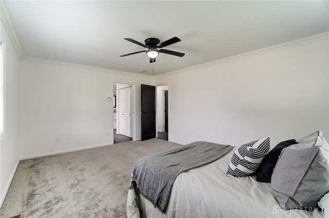 carpeted bedroom featuring crown molding and ceiling fan