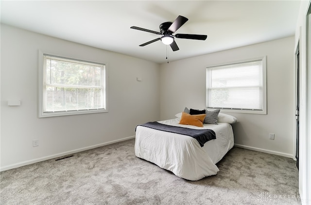 carpeted bedroom featuring ceiling fan