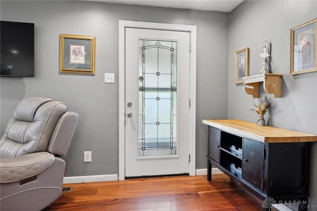 entryway with dark wood-type flooring