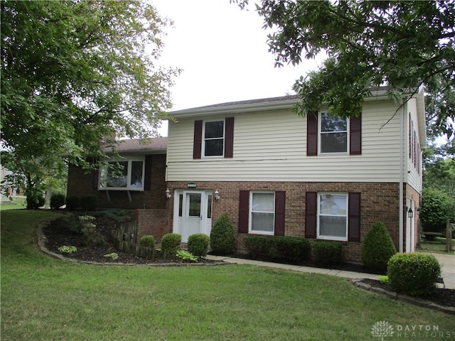 split level home with a front yard