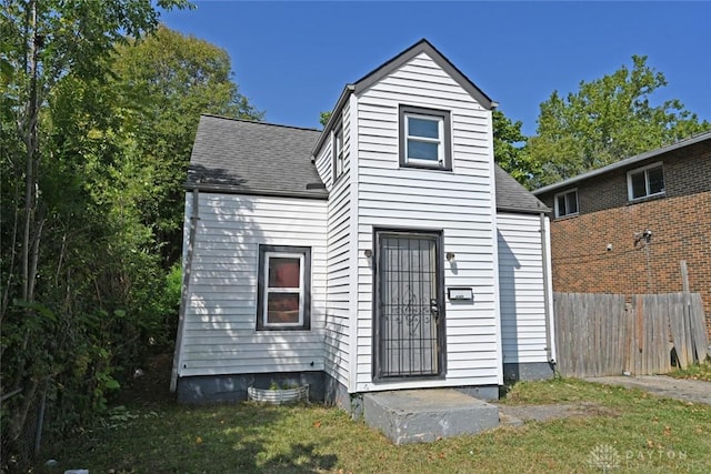 back of house with a yard