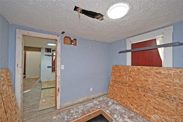 interior space featuring a textured ceiling