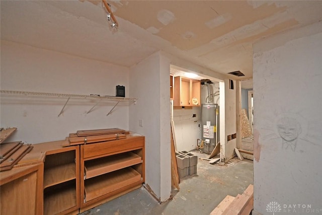 basement featuring gas water heater