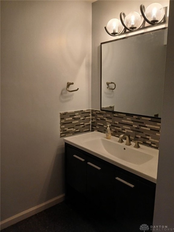 bathroom with vanity and backsplash