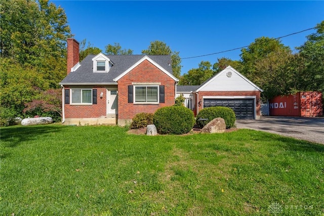 view of front of house with a front lawn and a garage