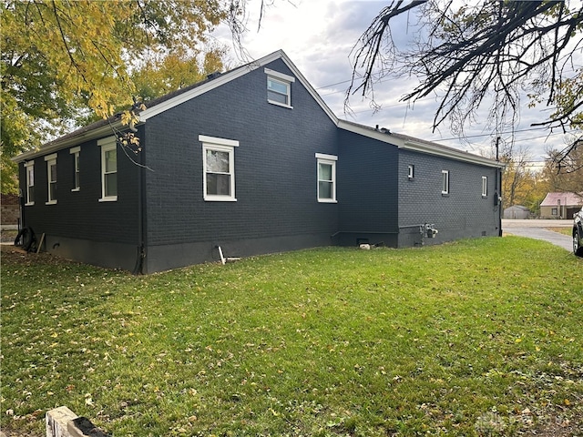 view of home's exterior featuring a yard