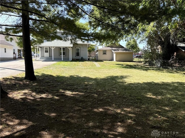 115 S Main St, Union, OH 45322 - view of green lawn featuring concrete driveway and an outbuilding