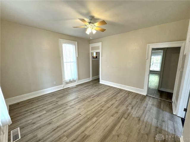 interior space featuring ceiling fan, a closet, and wood-type flooring