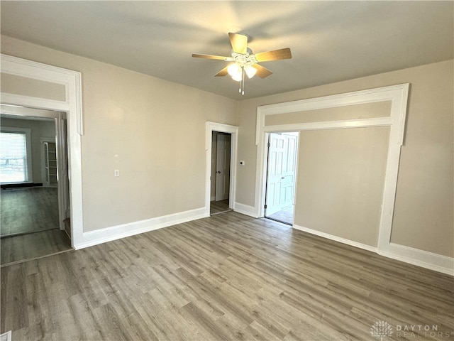 spare room featuring light wood-type flooring and ceiling fan