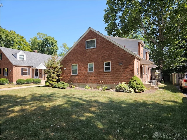 view of home's exterior with a yard