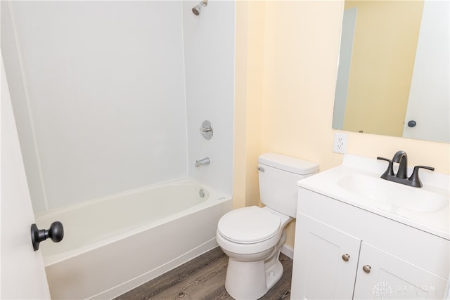 full bathroom featuring shower / bathing tub combination, vanity, wood-type flooring, and toilet