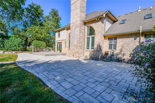 rear view of house featuring a patio