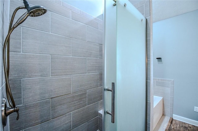 bathroom with a tile shower