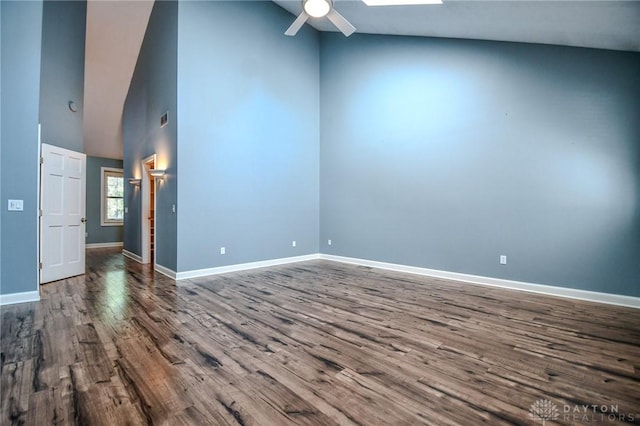 spare room with high vaulted ceiling, hardwood / wood-style floors, and ceiling fan