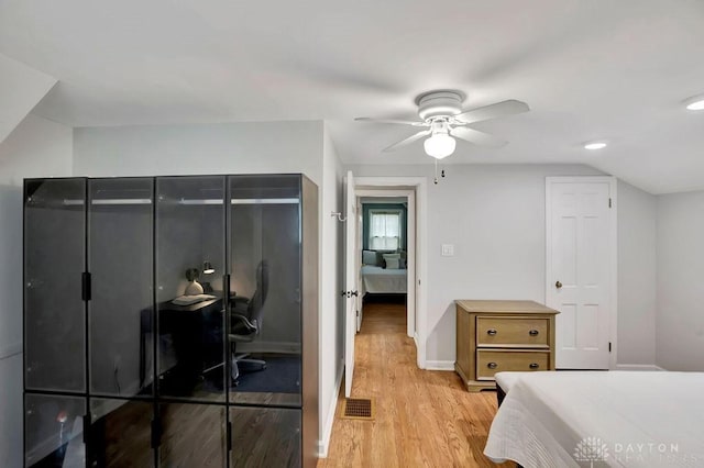 bedroom with ceiling fan and light hardwood / wood-style floors