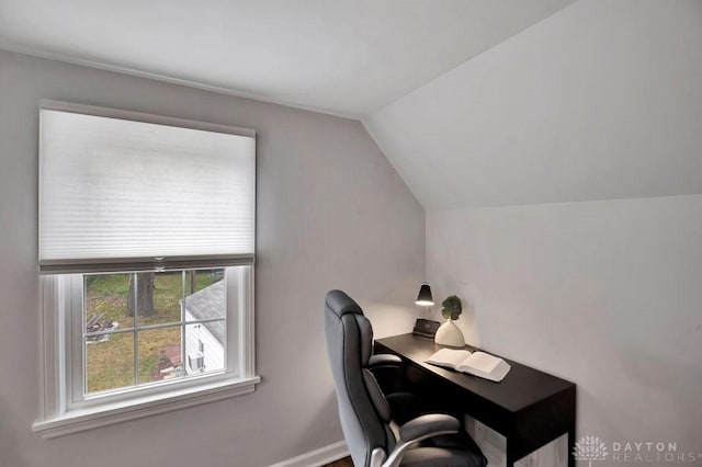 home office with lofted ceiling