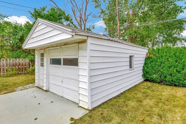 garage featuring a lawn