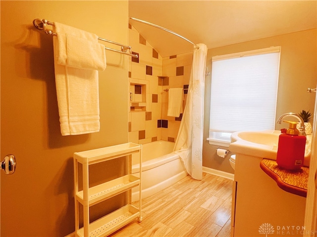 full bathroom with vanity, toilet, wood-type flooring, and shower / bath combo