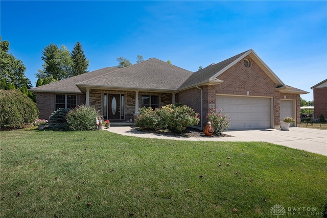 single story home with a garage and a front lawn