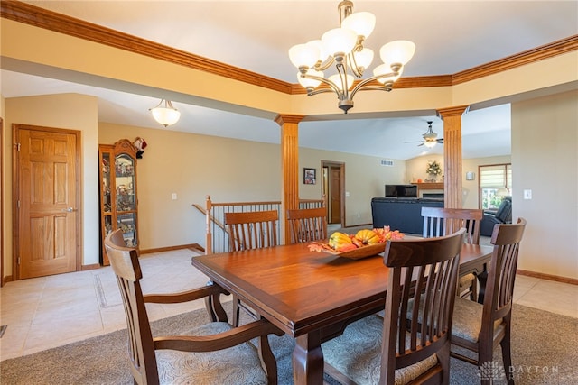 dining room with decorative columns, crown molding, ceiling fan with notable chandelier, and light tile patterned floors