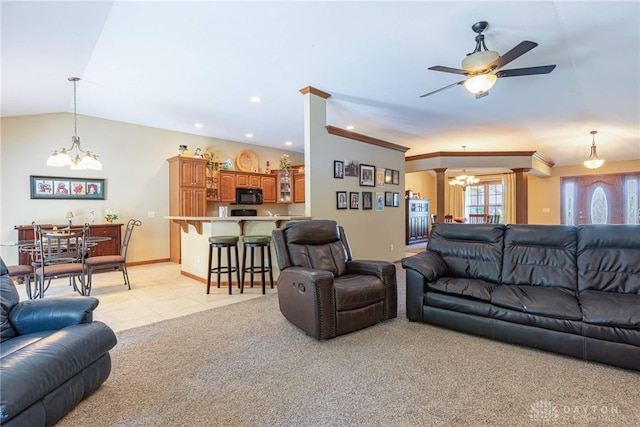 carpeted living room featuring crown molding, vaulted ceiling, and ceiling fan with notable chandelier