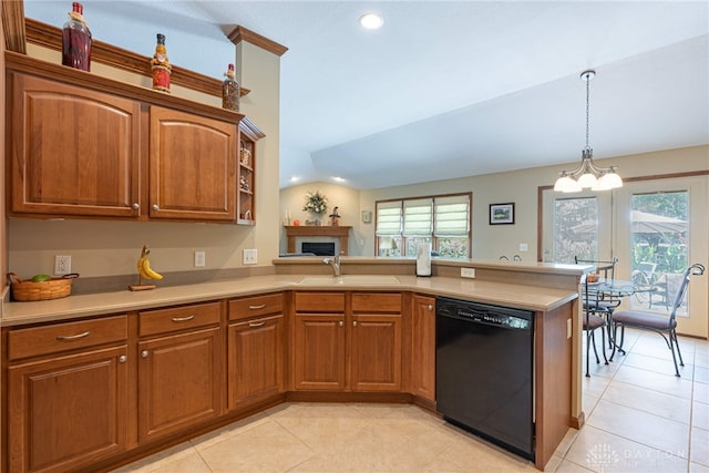 kitchen with a healthy amount of sunlight, sink, kitchen peninsula, and black dishwasher