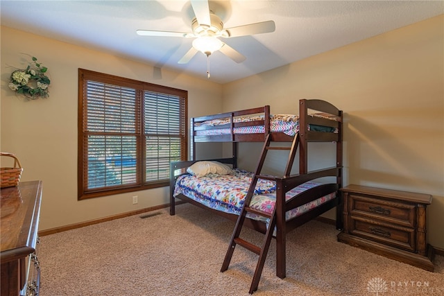 bedroom with light colored carpet and ceiling fan