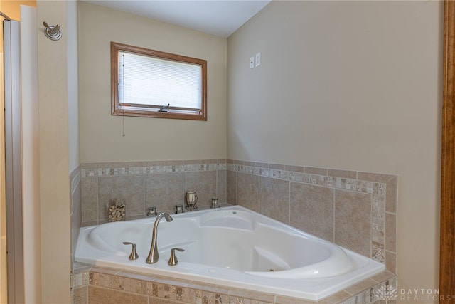 bathroom with a relaxing tiled tub