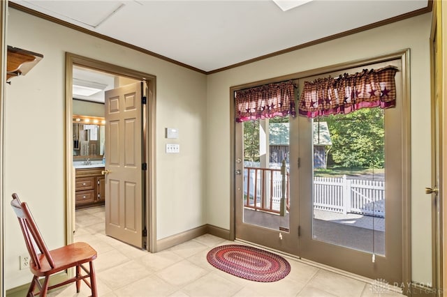 doorway to outside with crown molding, sink, and light tile patterned flooring