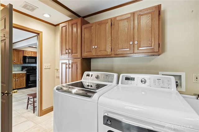 laundry room with cabinets, separate washer and dryer, ornamental molding, and light tile patterned flooring