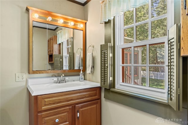 bathroom featuring vanity and crown molding