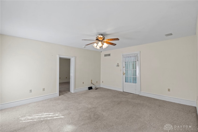 empty room with light carpet and ceiling fan