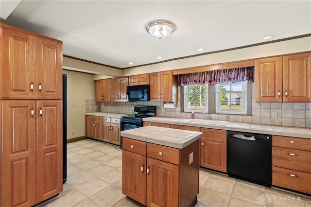 kitchen with black appliances, sink, decorative backsplash, tile counters, and light tile patterned flooring