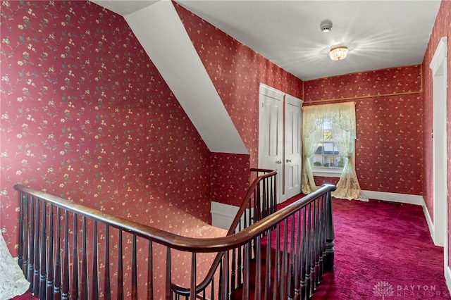 hallway featuring carpet flooring