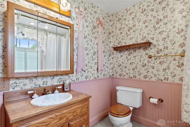 bathroom featuring vanity and toilet