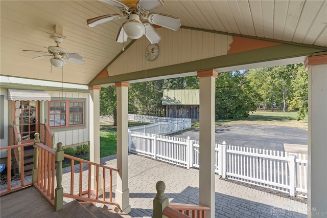 view of patio with ceiling fan and exterior bar