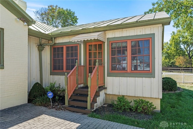 entrance to property with a patio