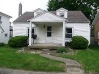 bungalow featuring a front lawn and a porch