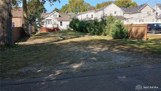 view of yard with fence and a residential view