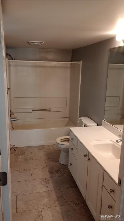 full bath featuring tub / shower combination, visible vents, toilet, and vanity