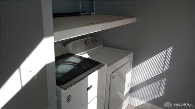 washroom with washer and dryer and laundry area