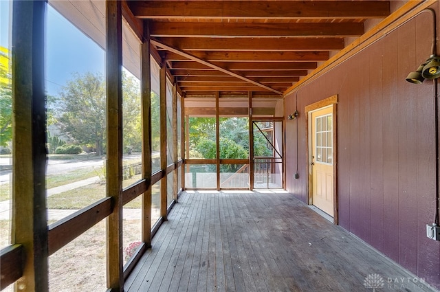 unfurnished sunroom featuring a healthy amount of sunlight