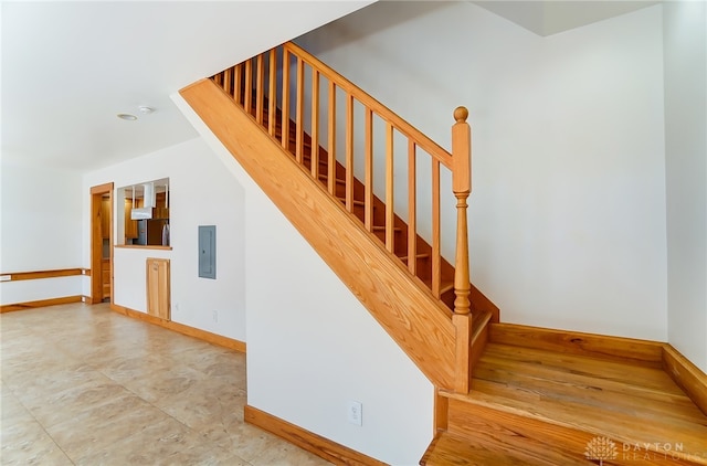 staircase with electric panel