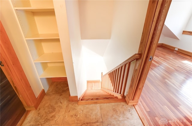 interior space with built in features and hardwood / wood-style flooring