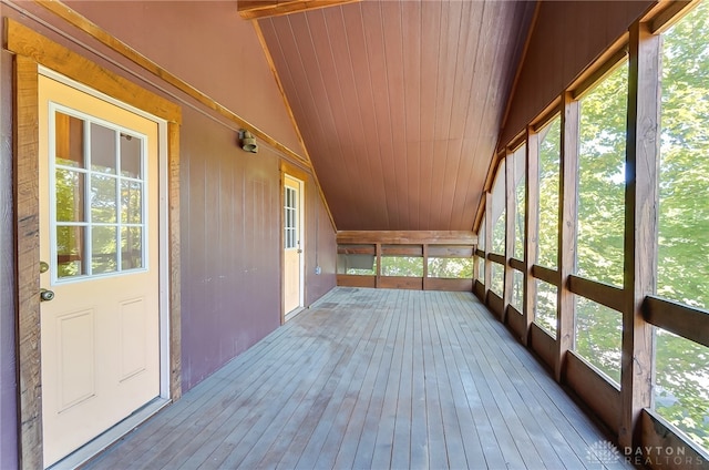 unfurnished sunroom featuring wooden ceiling and lofted ceiling