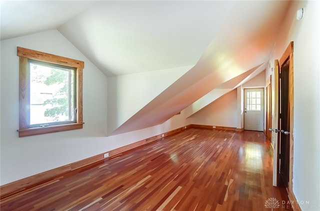 bonus room featuring lofted ceiling and wood-type flooring