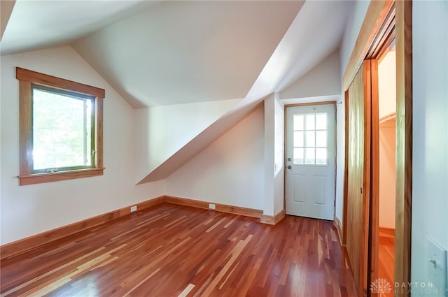 bonus room with lofted ceiling and wood-type flooring