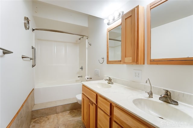 full bathroom featuring vanity, toilet, tile patterned floors, and bathing tub / shower combination