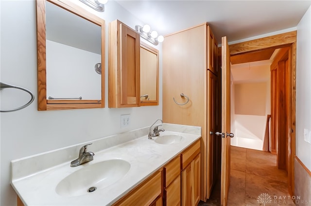 bathroom with tile patterned flooring and vanity